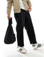 seasonal sling bag in black