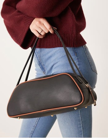 elongated angular bowler bag with contrast piping in black