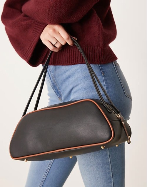 elongated angular bowler bag with contrast piping in black