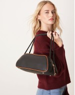 elongated angular bowler bag with contrast piping in black
