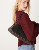 elongated angular bowler bag with contrast piping in black