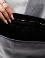 leather oversized clutch in black